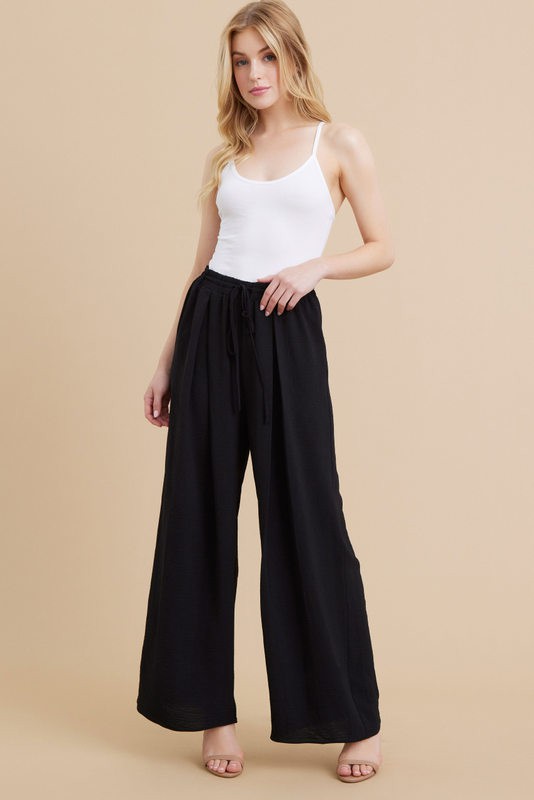 PLEATS FLARED PANTS