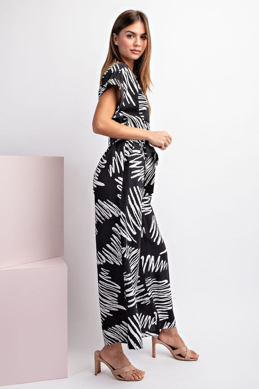 PRINTED JUMPSUIT WITH WAIST TIE